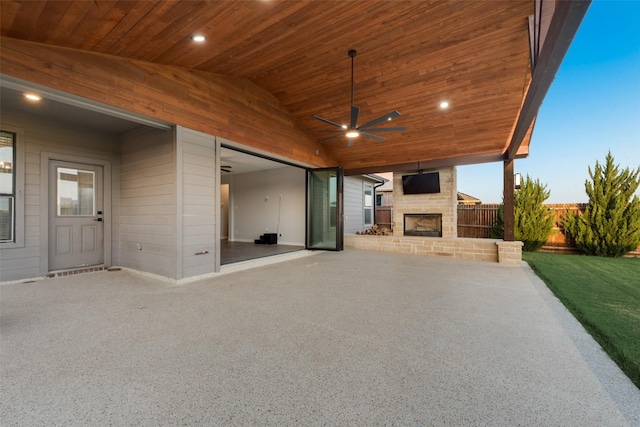 1424 Archway Ct, Fort Worth, TX 76247 - view of patio / terrace featuring an outdoor stone fireplace, ceiling fan, and a garage