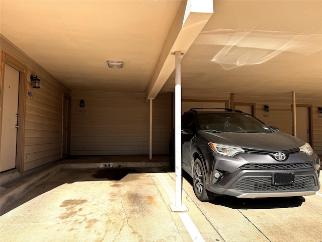 18240 Midway Rd Unit 902, Dallas, TX 75287 - garage featuring wooden walls