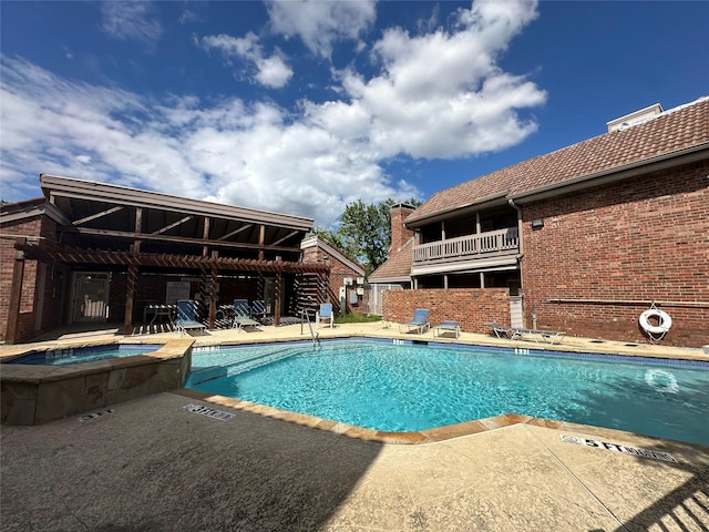 18240 Midway Rd Unit 902, Dallas, TX 75287 - community pool with a community hot tub and a patio