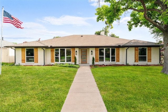 631 Wentworth Dr, Richardson, TX 75081 - view of front of property featuring brick siding and a front yard