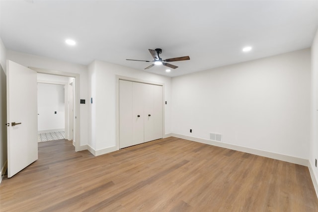 631 Wentworth Dr, Richardson, TX 75081 - unfurnished bedroom with recessed lighting, light wood-type flooring, a closet, and ceiling fan