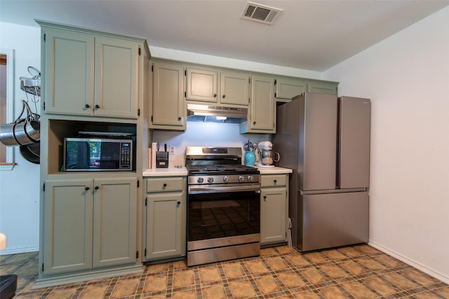 103 Irvin Ln, Mount Vernon, TX 75457 - kitchen with appliances with stainless steel finishes, under cabinet range hood, light countertops, and light flooring