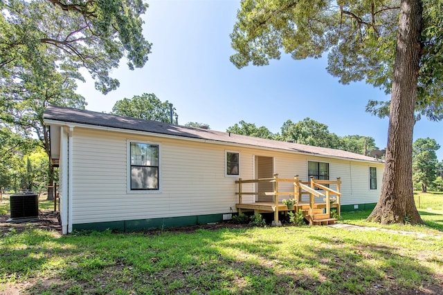 103 Irvin Ln, Mount Vernon, TX 75457 - back of property featuring a yard, a deck, and crawl space