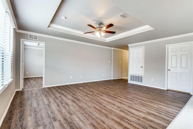 3109 Layla Creek Dr, Little Elm, TX 75068 - unfurnished living room featuring a raised ceiling, a ceiling fan, wood finished floors, and ornamental molding