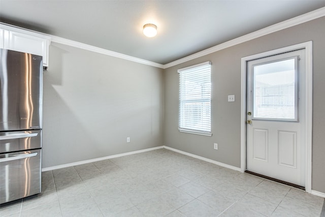 3109 Layla Creek Dr, Little Elm, TX 75068 - unfurnished dining area with ornamental molding and light tile patterned flooring