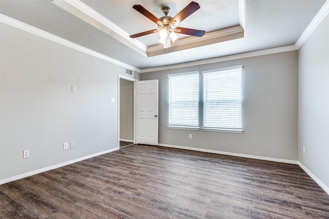 3109 Layla Creek Dr, Little Elm, TX 75068 - empty room featuring a raised ceiling, dark wood-style flooring, crown molding, and ceiling fan