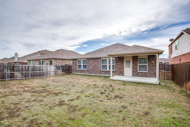 3109 Layla Creek Dr, Little Elm, TX 75068 - back of property featuring brick siding, a patio, and a fenced backyard
