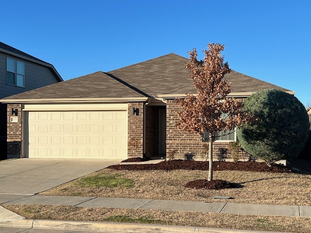3109 Layla Creek Dr, Little Elm, TX 75068 - ranch-style house with a garage, concrete driveway, a shingled roof, and brick siding