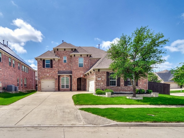 12815 Lourdes Ln, Frisco, TX 75035 - traditional-style home featuring concrete driveway, brick siding, a front lawn, and roof with shingles