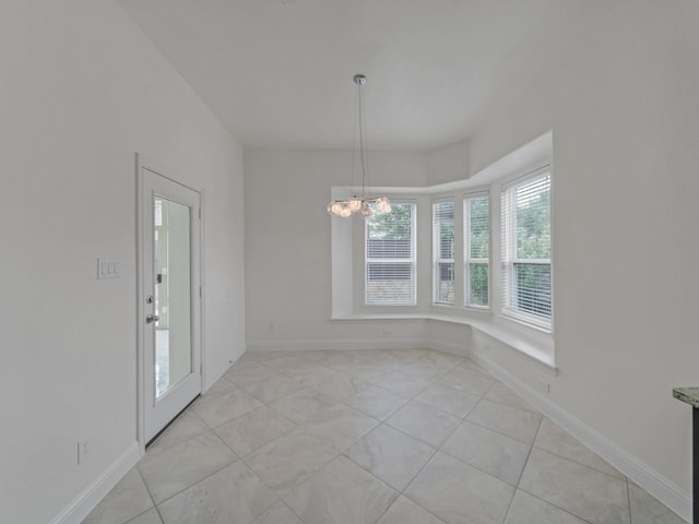 12815 Lourdes Ln, Frisco, TX 75035 - unfurnished dining area featuring a chandelier and light tile patterned floors