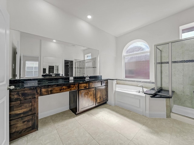 12815 Lourdes Ln, Frisco, TX 75035 - bathroom with a shower stall, healthy amount of natural light, a bath, vanity, and recessed lighting