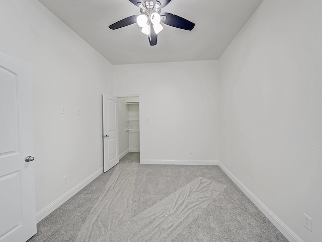 12815 Lourdes Ln, Frisco, TX 75035 - unfurnished bedroom with light carpet, a walk in closet, and ceiling fan