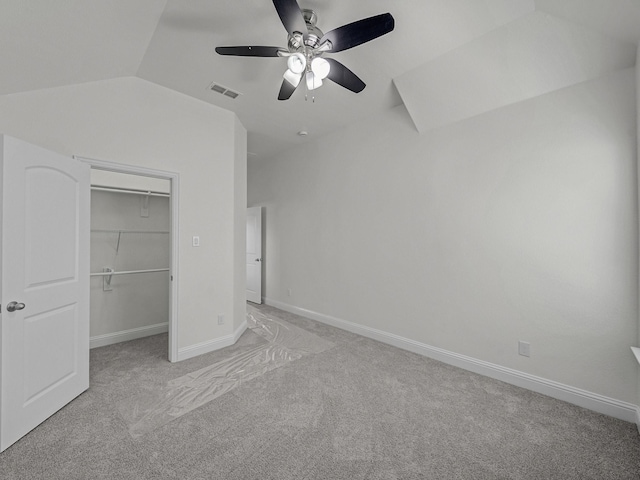 12815 Lourdes Ln, Frisco, TX 75035 - unfurnished bedroom with light colored carpet, vaulted ceiling, a walk in closet, a closet, and ceiling fan