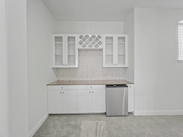 12815 Lourdes Ln, Frisco, TX 75035 - kitchen with light colored carpet, tasteful backsplash, and glass insert cabinets