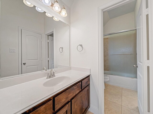 12815 Lourdes Ln, Frisco, TX 75035 - bathroom featuring vanity, tile patterned floors, and enclosed tub / shower combo