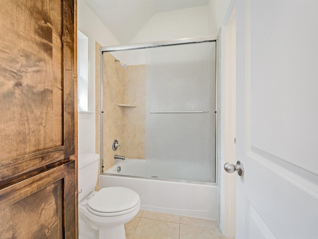 12815 Lourdes Ln, Frisco, TX 75035 - full bathroom with tile patterned flooring, combined bath / shower with glass door, and vaulted ceiling
