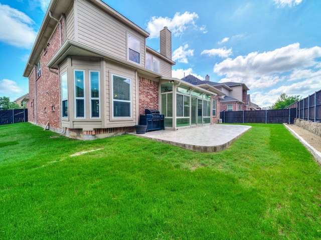 12815 Lourdes Ln, Frisco, TX 75035 - back of house featuring a patio area, a chimney, brick siding, and a fenced backyard