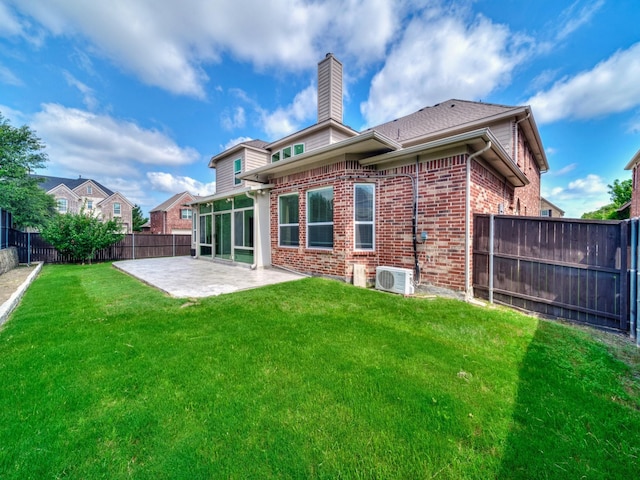 12815 Lourdes Ln, Frisco, TX 75035 - back of house with a patio area, a chimney, brick siding, and a fenced backyard