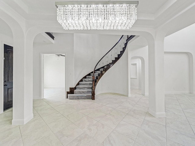 12815 Lourdes Ln, Frisco, TX 75035 - foyer entrance featuring arched walkways, stairway, and ceiling fan