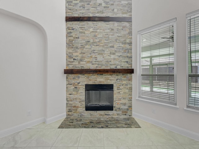 12815 Lourdes Ln, Frisco, TX 75035 - detailed view of a tiled fireplace and baseboards