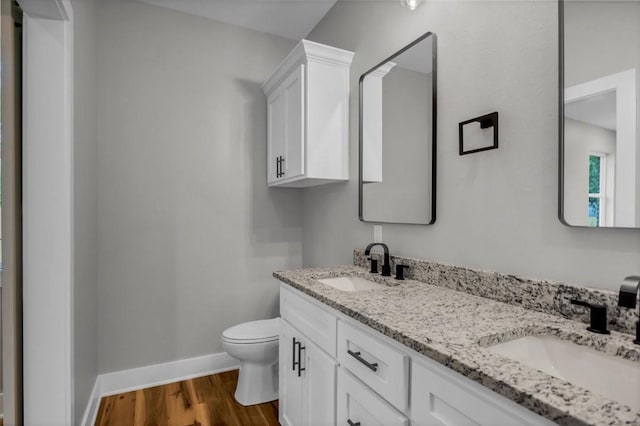 1002 E Main, Whitehouse, TX 75791 - bathroom with double vanity and wood finished floors