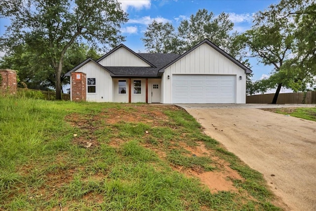 1002 E Main, Whitehouse, TX 75791 - modern inspired farmhouse featuring driveway, an attached garage, roof with shingles, and board and batten siding