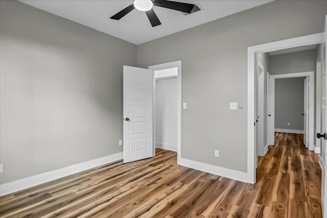 1002 E Main, Whitehouse, TX 75791 - unfurnished bedroom featuring wood finished floors and ceiling fan