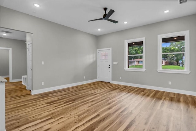 1002 E Main, Whitehouse, TX 75791 - unfurnished room featuring light wood-style floors, a ceiling fan, and recessed lighting