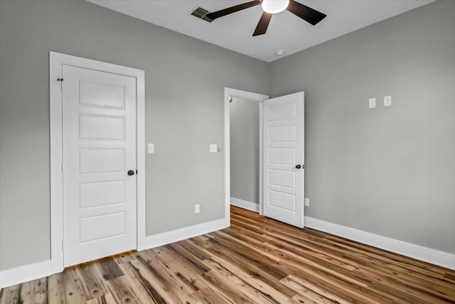 1002 E Main, Whitehouse, TX 75791 - unfurnished bedroom featuring wood finished floors and ceiling fan