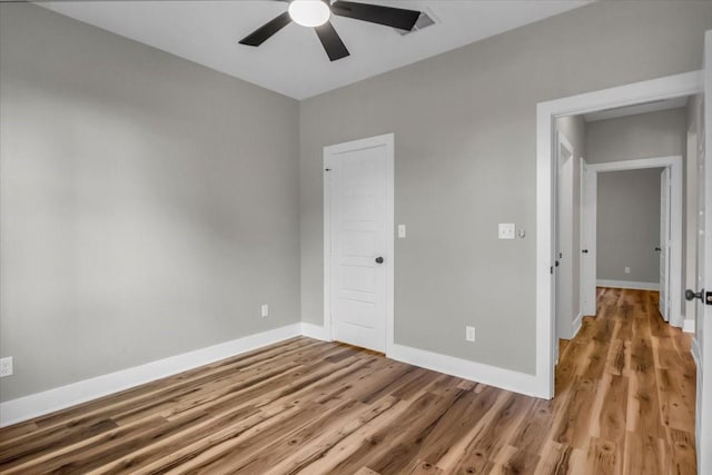 1002 E Main, Whitehouse, TX 75791 - empty room with ceiling fan and light wood-style floors