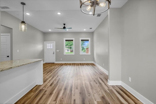 1002 E Main, Whitehouse, TX 75791 - unfurnished living room with light wood finished floors, ceiling fan, and recessed lighting