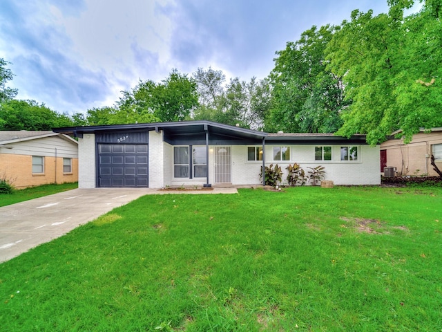 5537 Wheaton Dr, Fort Worth, TX 76133 - view of front of home with an attached garage, concrete driveway, a front yard, and brick siding