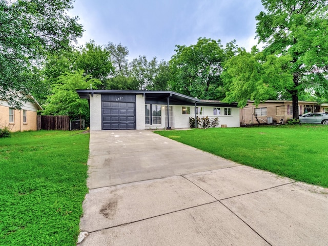 5537 Wheaton Dr, Fort Worth, TX 76133 - view of front of home featuring an attached garage, concrete driveway, and brick siding