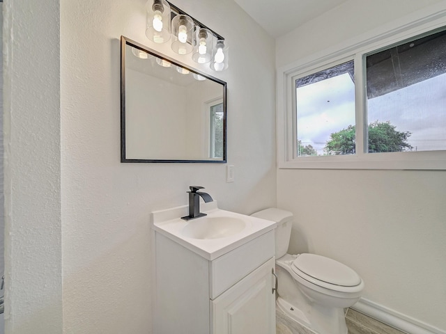 5537 Wheaton Dr, Fort Worth, TX 76133 - half bath featuring vanity and toilet