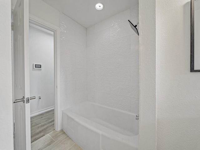 5537 Wheaton Dr, Fort Worth, TX 76133 - bathroom featuring shower / washtub combination and wood finished floors