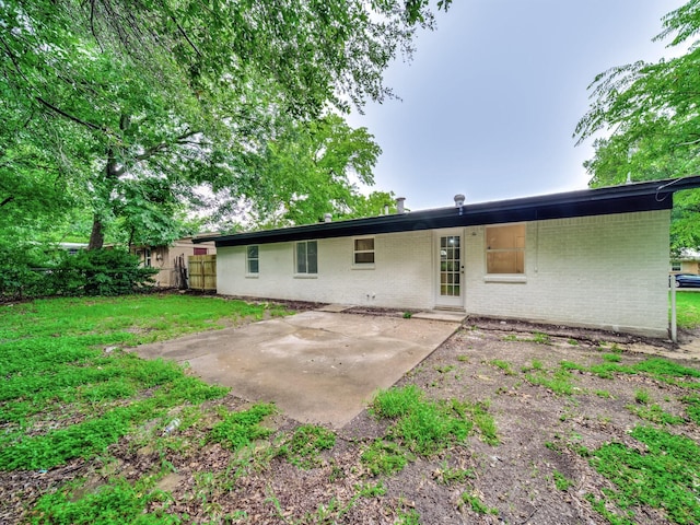 5537 Wheaton Dr, Fort Worth, TX 76133 - back of house featuring brick siding and a patio