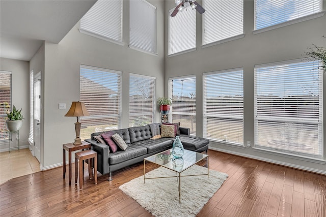 3537 Navarro Way, Frisco, TX 75034 - living room with plenty of natural light, hardwood / wood-style floors, a ceiling fan, and a towering ceiling