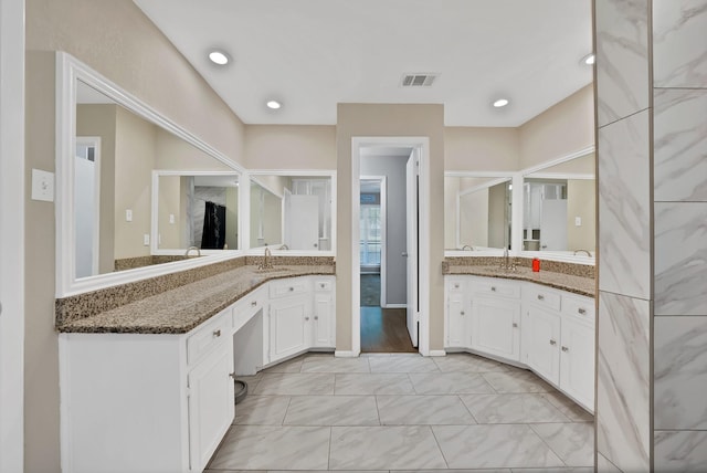 7329 Yolanda Dr, Fort Worth, TX 76112 - full bathroom featuring two vanities and marble finish floors