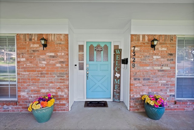 7329 Yolanda Dr, Fort Worth, TX 76112 - view of exterior entry with brick siding and a porch