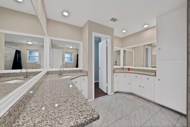 7329 Yolanda Dr, Fort Worth, TX 76112 - full bathroom with two vanities, marble look tile flooring, and a shower with curtain