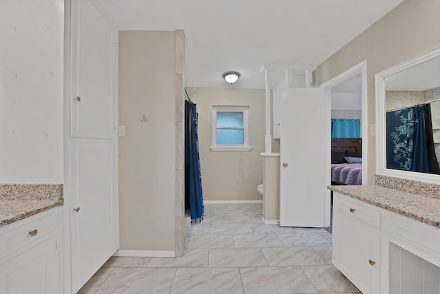 7329 Yolanda Dr, Fort Worth, TX 76112 - ensuite bathroom featuring a shower with curtain, marble finish floors, and vanity