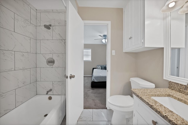 7329 Yolanda Dr, Fort Worth, TX 76112 - bathroom with marble look tile flooring, vanity, a ceiling fan, washtub / shower combination, and ensuite bathroom