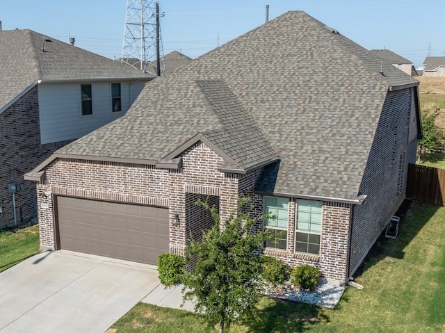 14613 Martin Creek Cv, Fort Worth, TX 76262 - french country inspired facade with a shingled roof, an attached garage, brick siding, and driveway