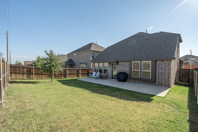 14613 Martin Creek Cv, Fort Worth, TX 76262 - back of house with roof with shingles, brick siding, a patio, and a fenced backyard