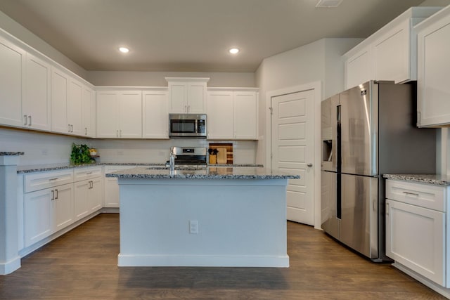 14613 Martin Creek Cv, Fort Worth, TX 76262 - kitchen featuring appliances with stainless steel finishes, stone countertops, decorative backsplash, white cabinets, and recessed lighting
