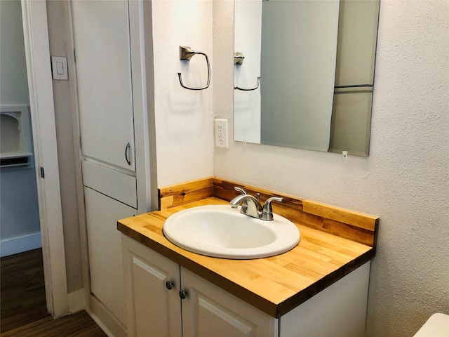 716 Kessler Blvd, Sherman, TX 75092 - bathroom with vanity and wood finished floors