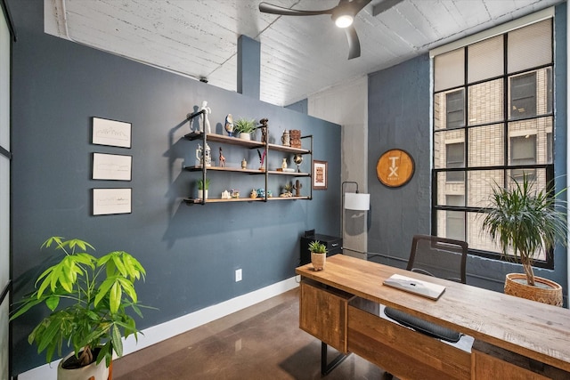 1122 Jackson St Unit 418, Dallas, TX 75202 - home office featuring a ceiling fan and concrete flooring