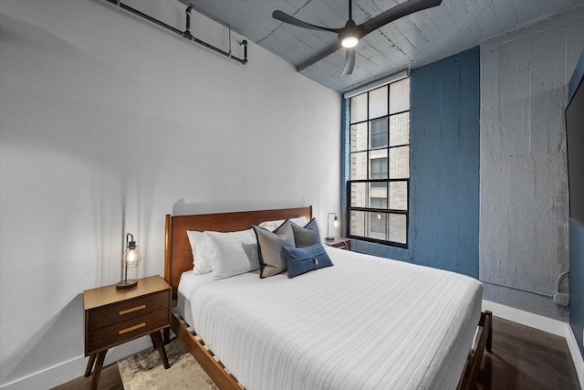 1122 Jackson St Unit 418, Dallas, TX 75202 - bedroom with baseboards and a ceiling fan