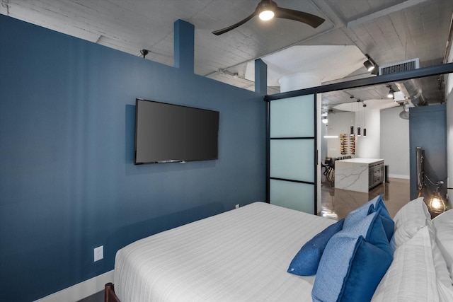 1122 Jackson St Unit 418, Dallas, TX 75202 - bedroom with baseboards and a ceiling fan