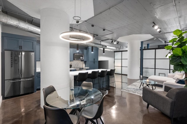 1122 Jackson St Unit 418, Dallas, TX 75202 - dining room featuring concrete flooring